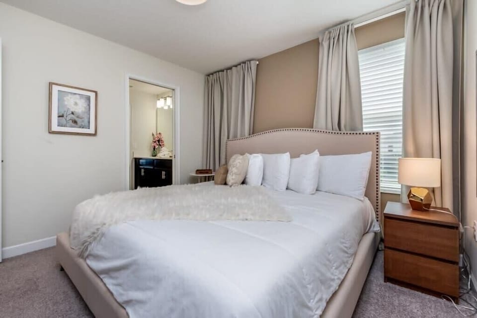 Gather in the inviting living room with comfortable furnishings, a large flat-screen TV, and complimentary high-speed Wi-Fi for entertainment and relaxation.