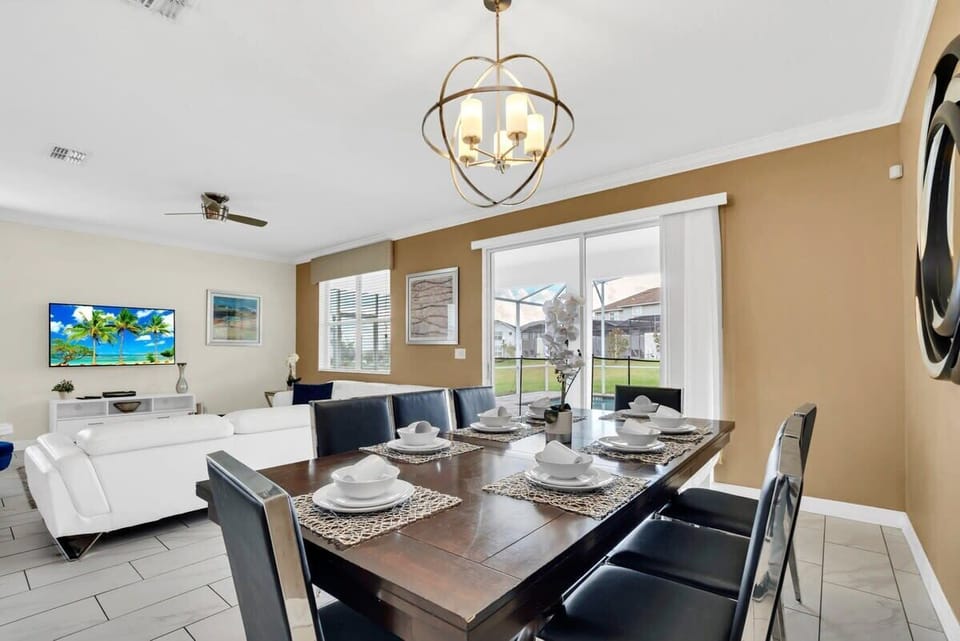 Enjoy memorable family meals around the dining table, where the open-concept layout keeps everyone connected to the kitchen and living room.