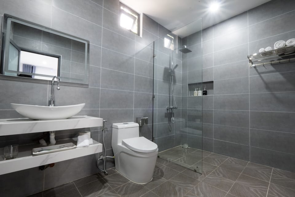 Shower, hydromassage showerhead, designer toiletries, hair dryer