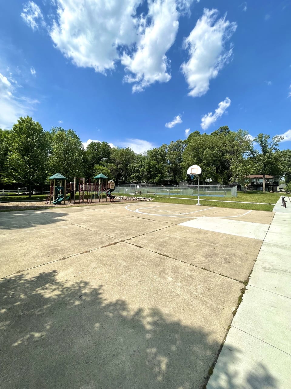 Basketball court in park to east of property 