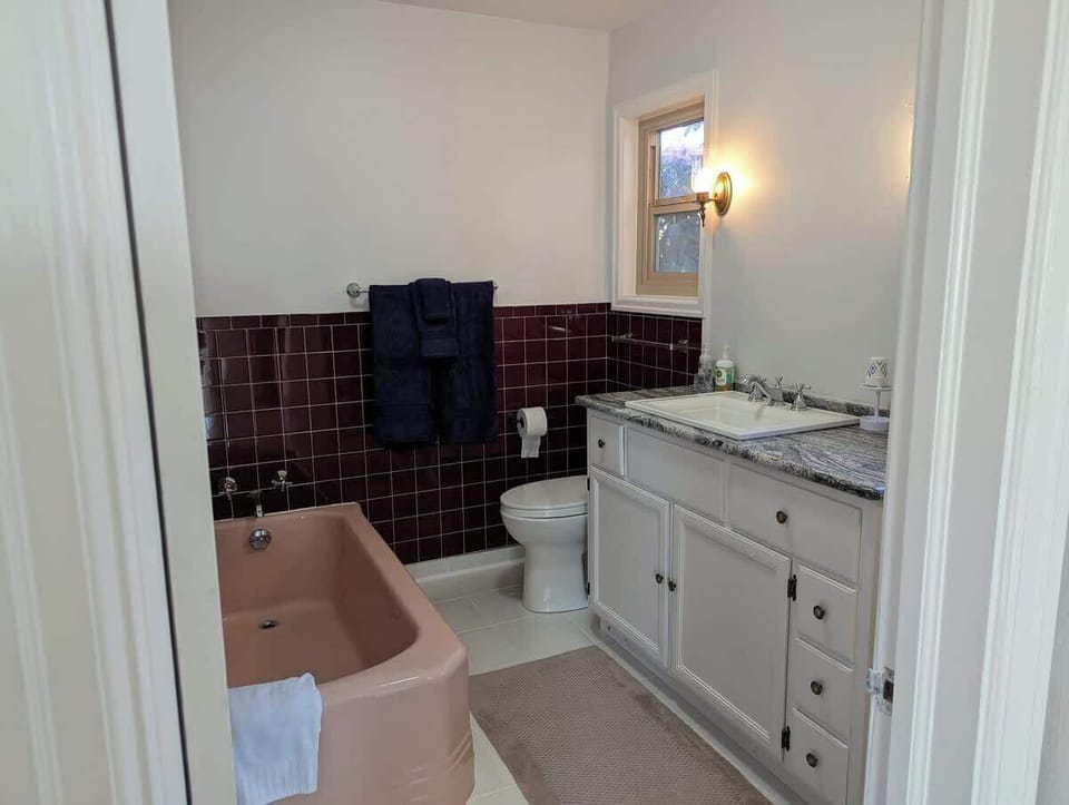 Your private has a 1950 pink bathtub and a separate shower.