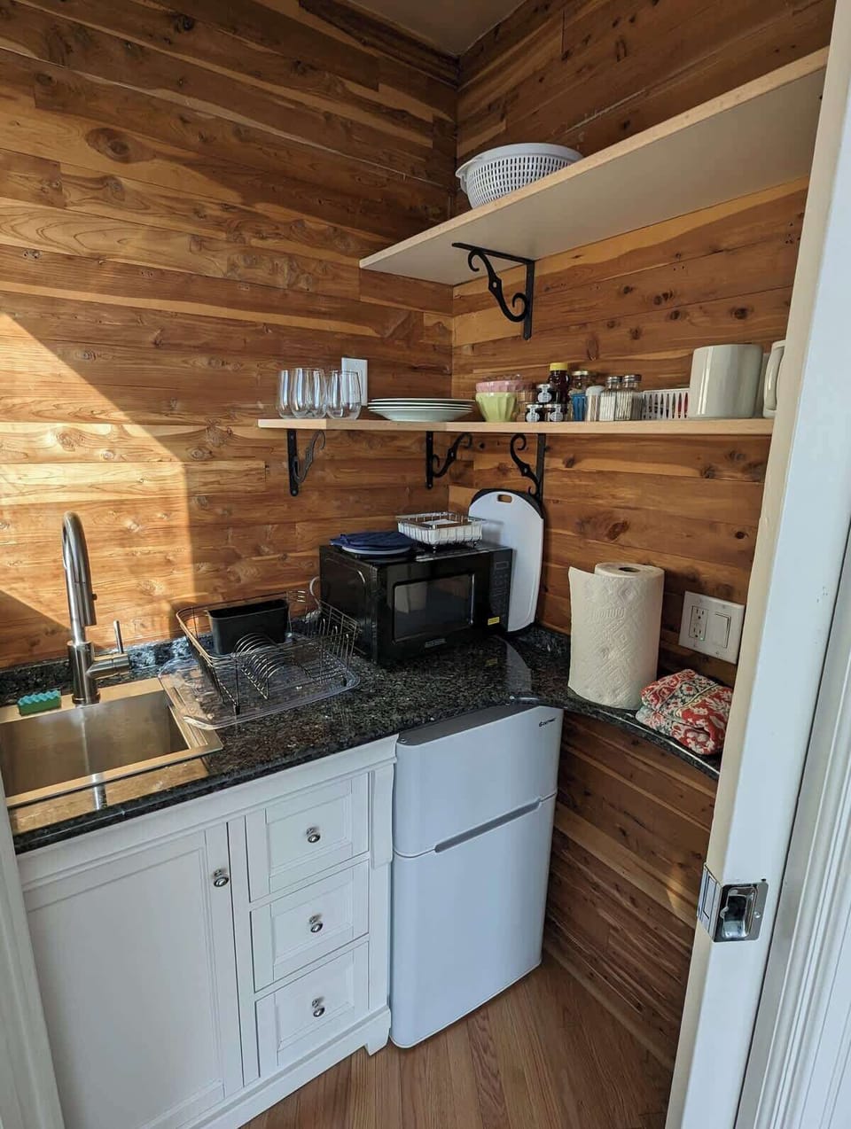 Your kitchenette has a sink, refrigerator, microwave, toaster & hotplate