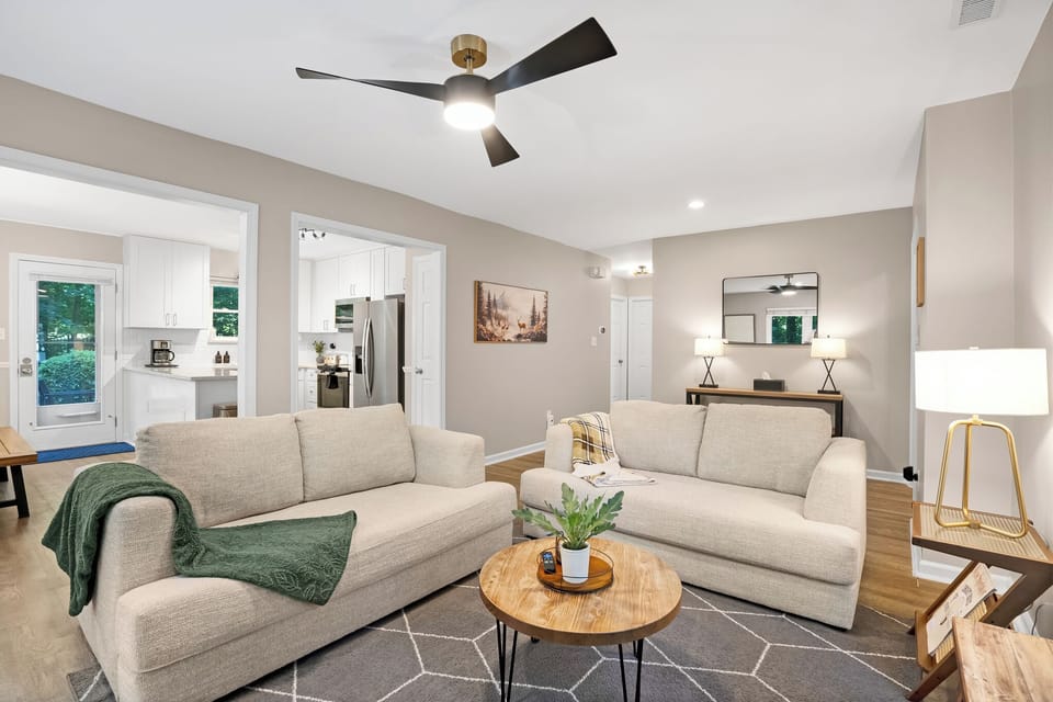 "Open concept living room with a view to kitchen and dining room"