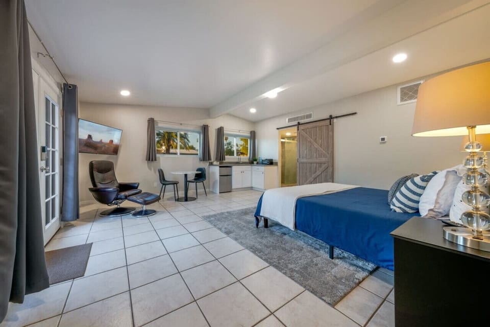 Bedroom 4, a large suite with king-size bed, kitchenette, and en suite