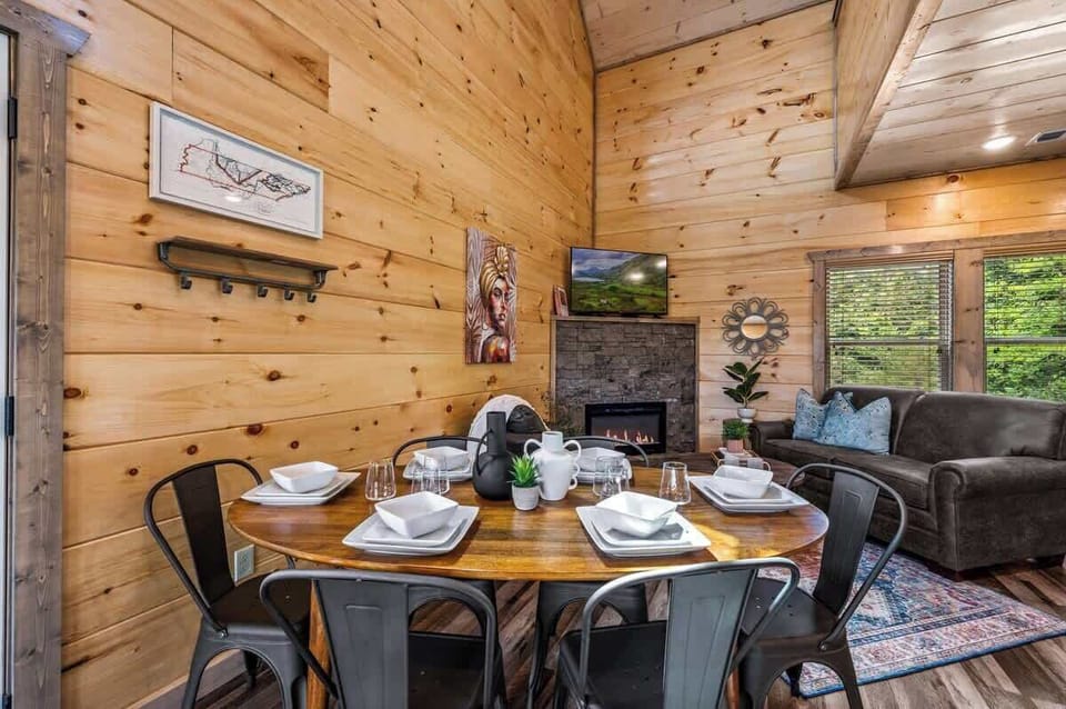 The large flat-screen TV with cable channels offers endless entertainment options, perfect for movie nights or catching up on your favorite shows while dining and relaxing.