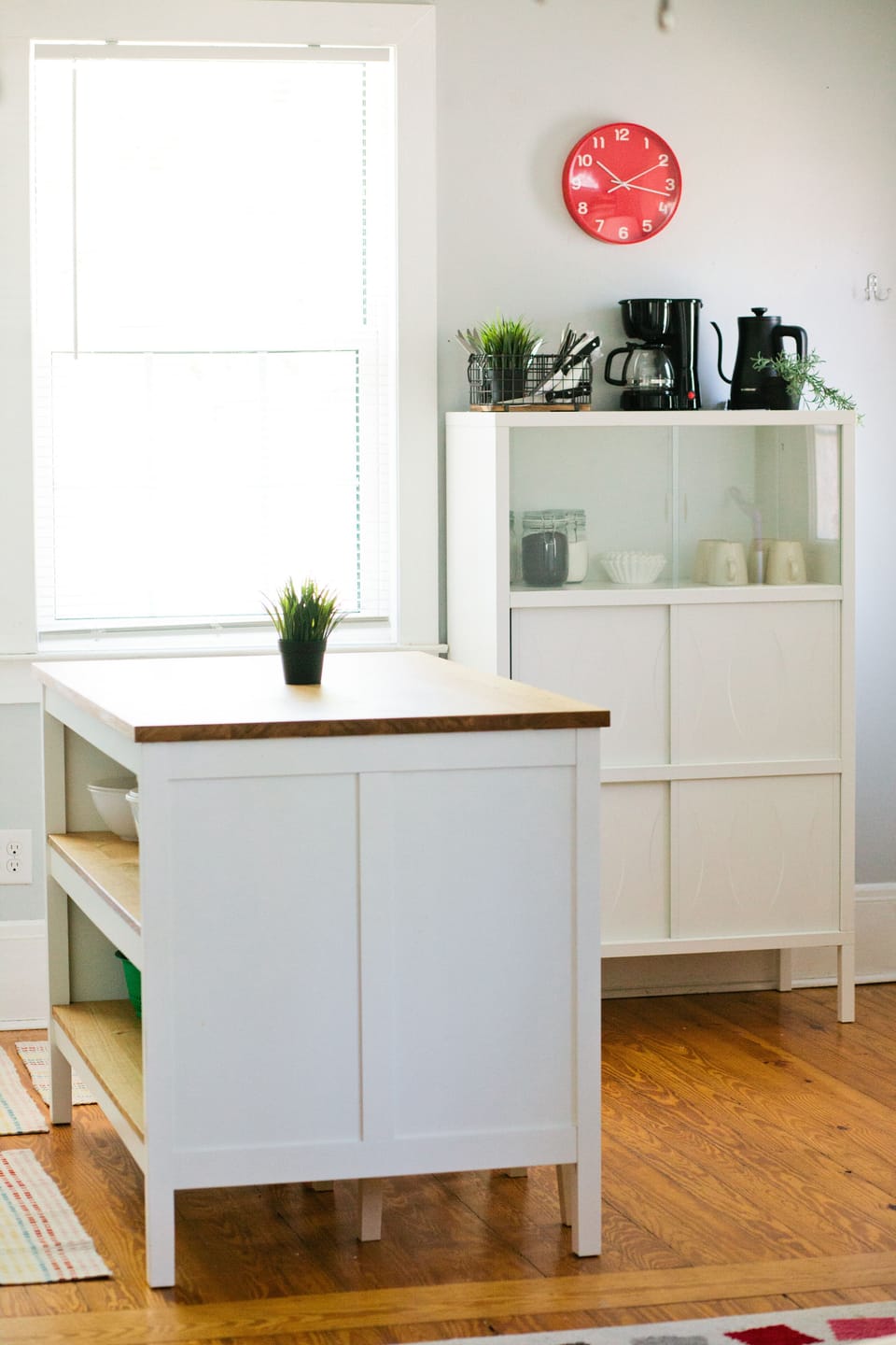 This kitchen island serves as both storage and a dinner table