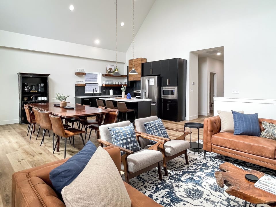 Open concept bright and airy great room, dining and kitchen.