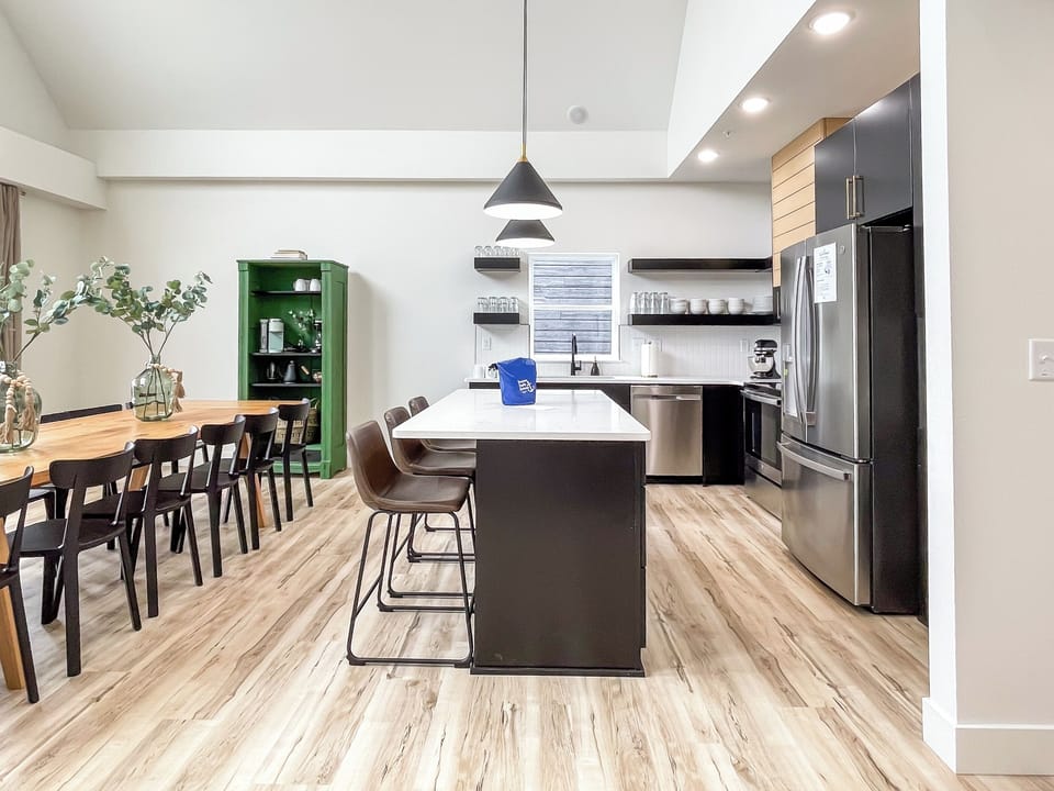 Main level open concept dining and kitchen with abundant seating