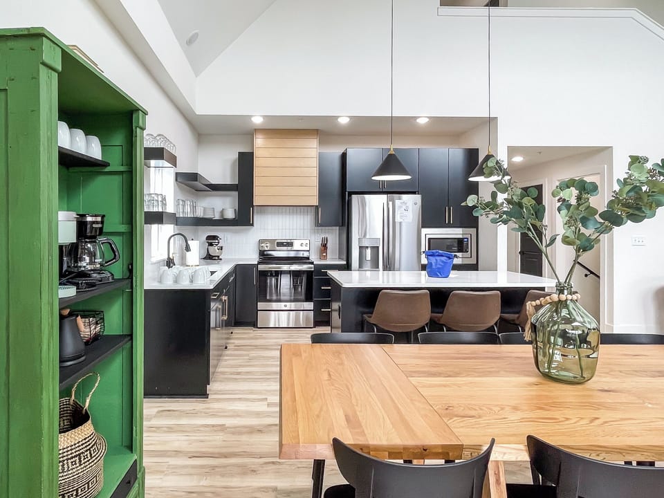 Main level open concept dining and kitchen with abundant seating