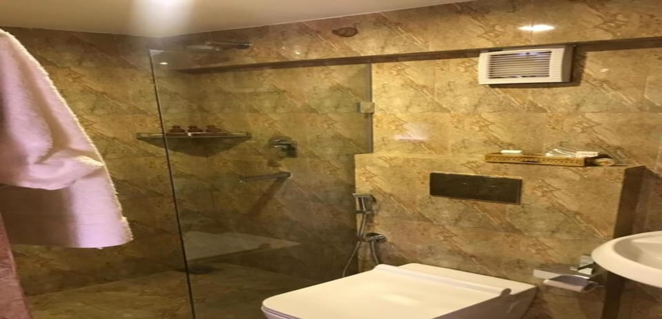 Shower, rainfall showerhead, towels, soap