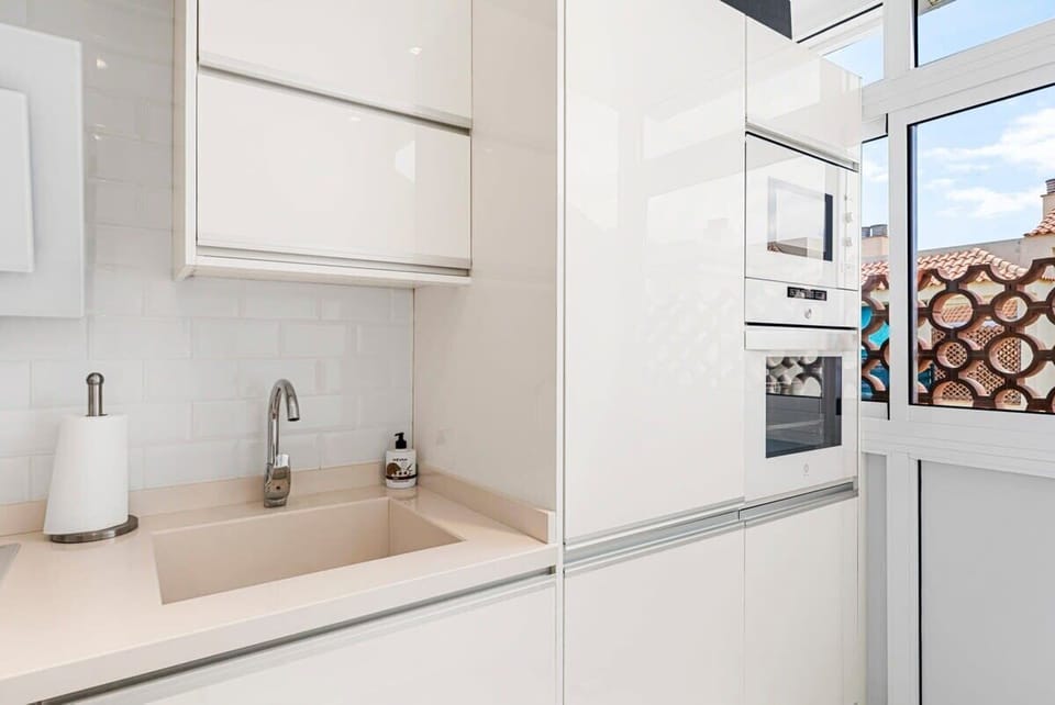 Kitchen with Dishwasher, Washing Machine, Microwave, Oven, Stove