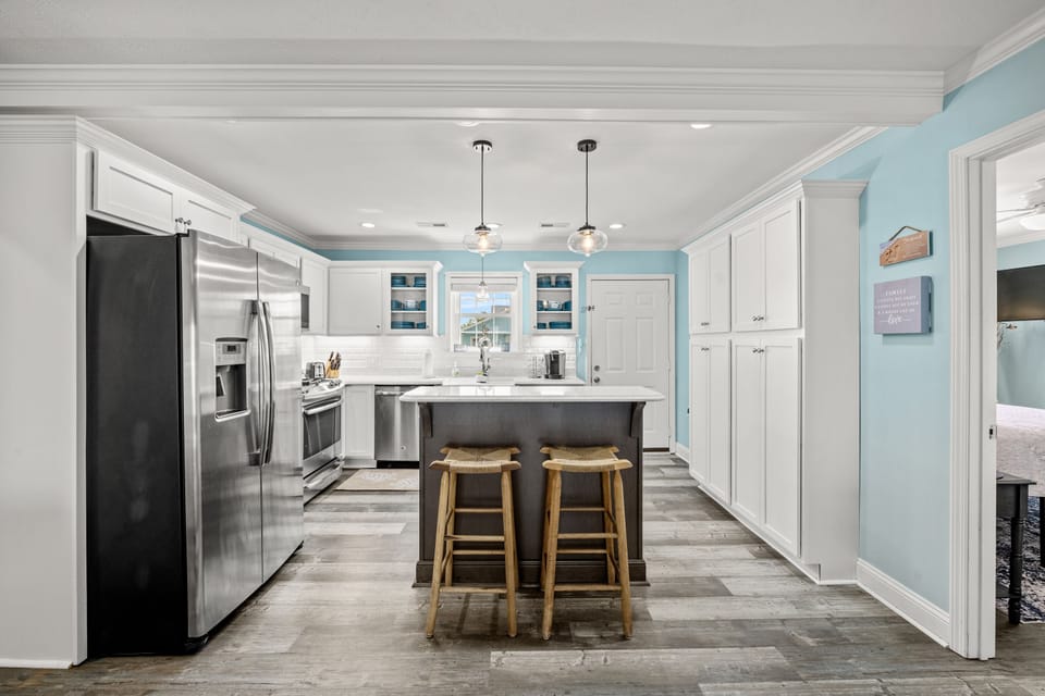The kitchen island provides additional counter space for serving snacks or meals