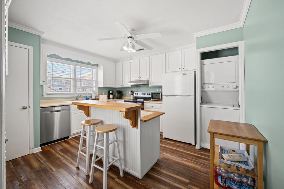 The kitchen island provides additional counter space for serving snacks or meals