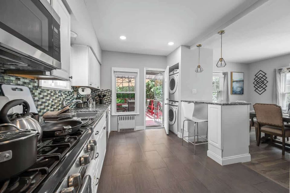 Beautifully decorated open concept kitchen with walkout deck. Lots of natural light