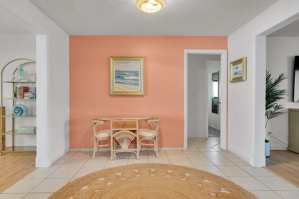 Honeymoon table in kitchen, with pocket door to 3 bedrooms and a bathroom.