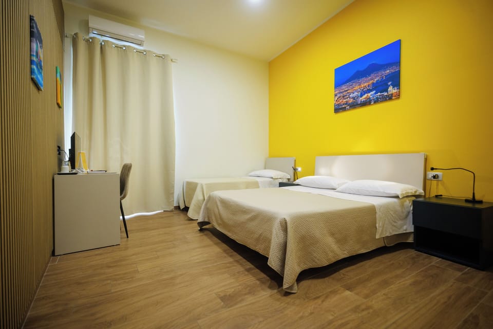 Deluxe Triple Room | Minibar, individually furnished, desk, laptop workspace