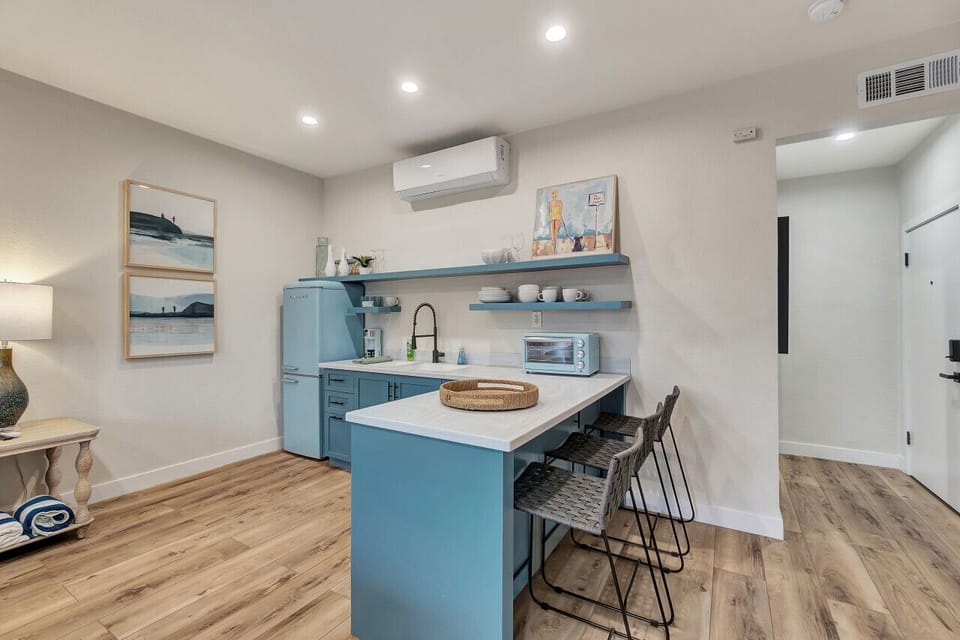 Sleek kitchen island w/ bar seating, perfect for casual dining or morning coffee