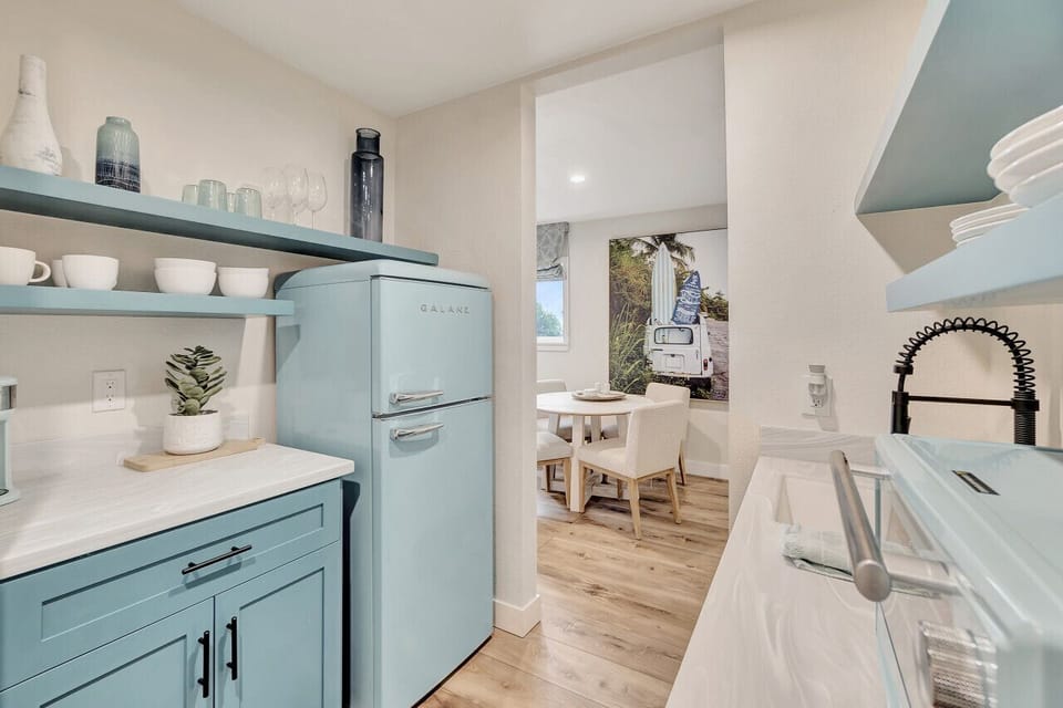 Well-equipped kitchenette w/ open shelving & modern touches for a convenient stay