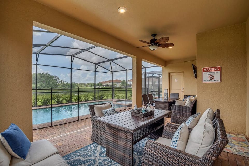 Comfortable seating outdoors with view of conservation and a TV