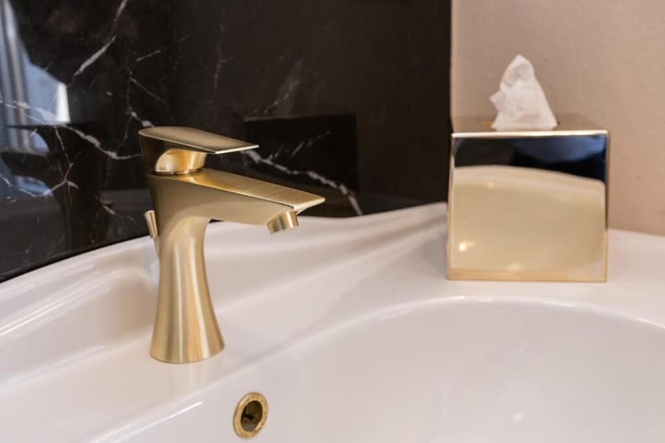 Shower, rainfall showerhead, designer toiletries, hair dryer