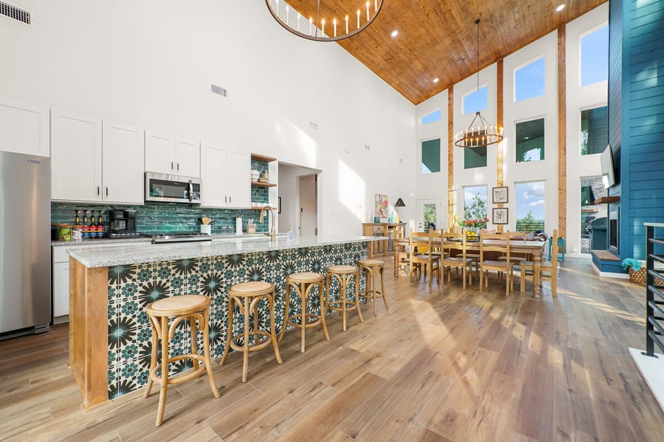 Open concept kitchen, dining, and living area.
