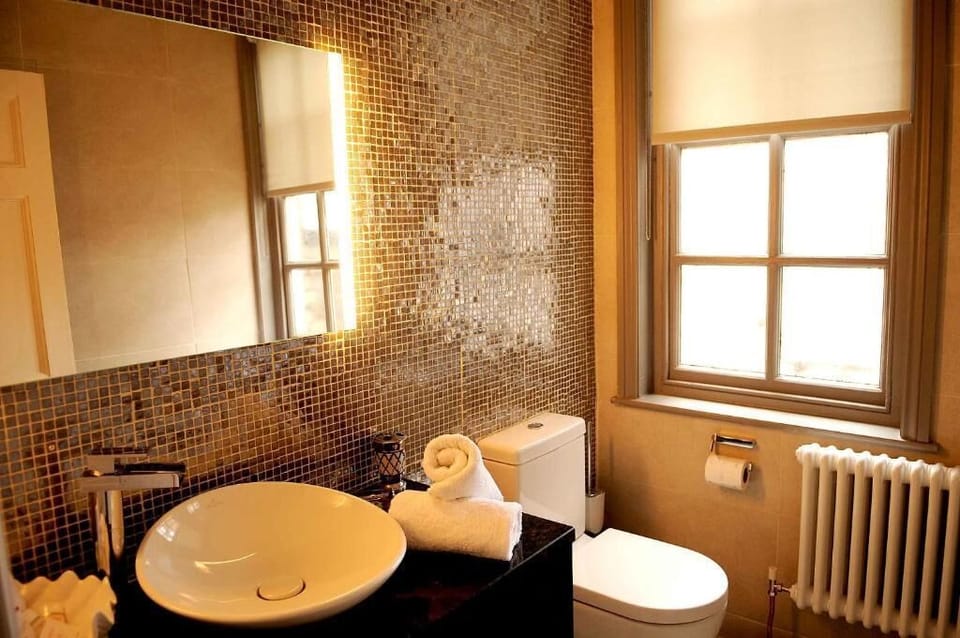 Designer toiletries, hair dryer, bathrobes, slippers