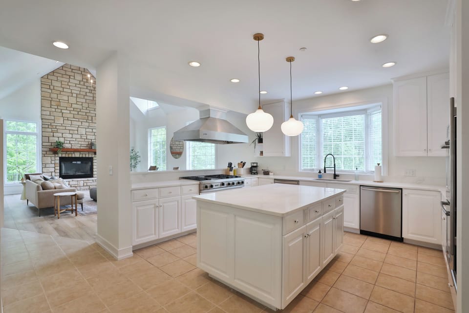 Open kitchen with updated appliances connected to main living area. 
(no stairs)