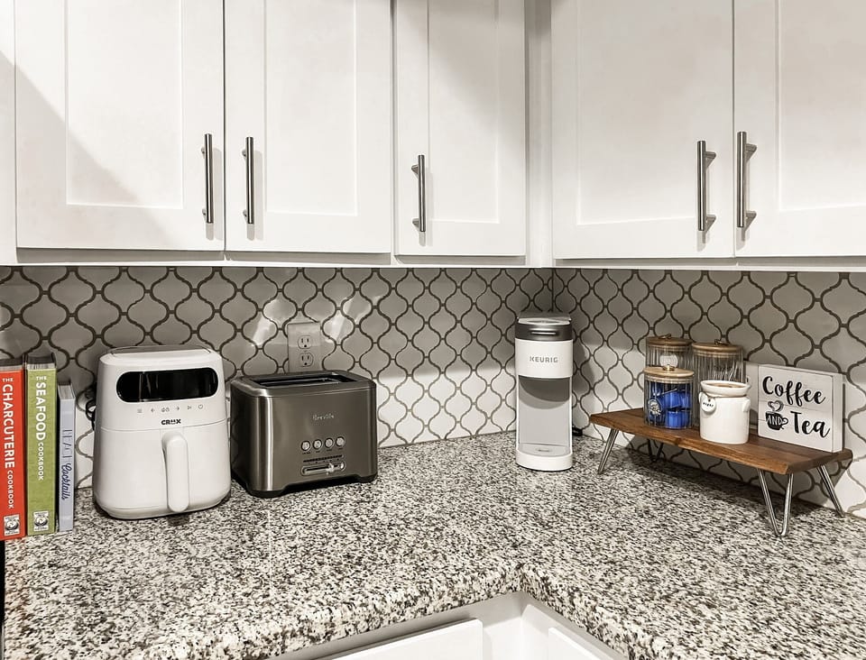 Well equipped kitchen, with Keurig coffee maker, airfryer, and toaster