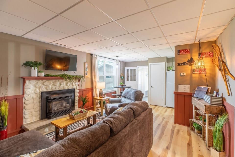 Indulge in comfort and style in our living room, featuring plush sofas, and elegant chairs. Cozy up by the fireplace, and unwind with entertainment on the TV.