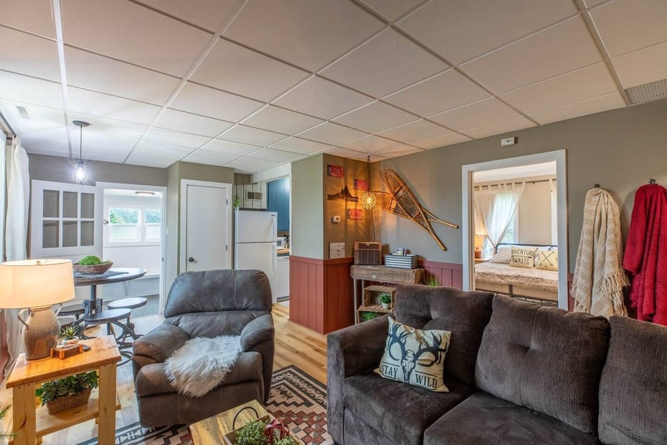 Indulge in comfort and style in our living room, featuring plush sofas, and elegant chairs. Cozy up by the fireplace, and unwind with entertainment on the TV.