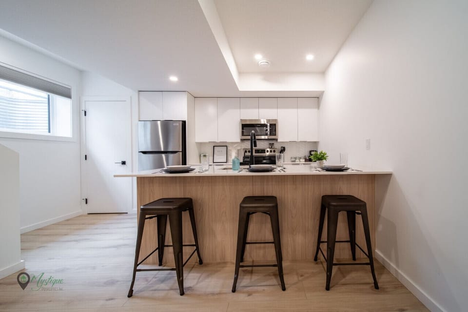 Kitchen bar stool seating in bright space