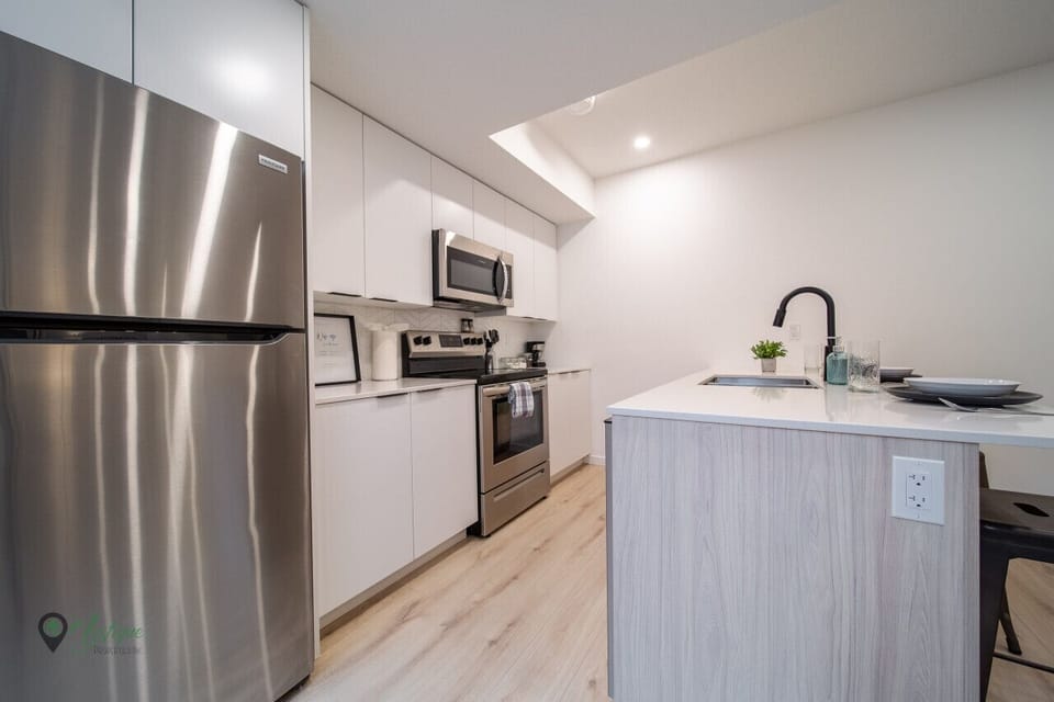 Kitchen with full size fridge, stove, oven, microwave and dishwasher