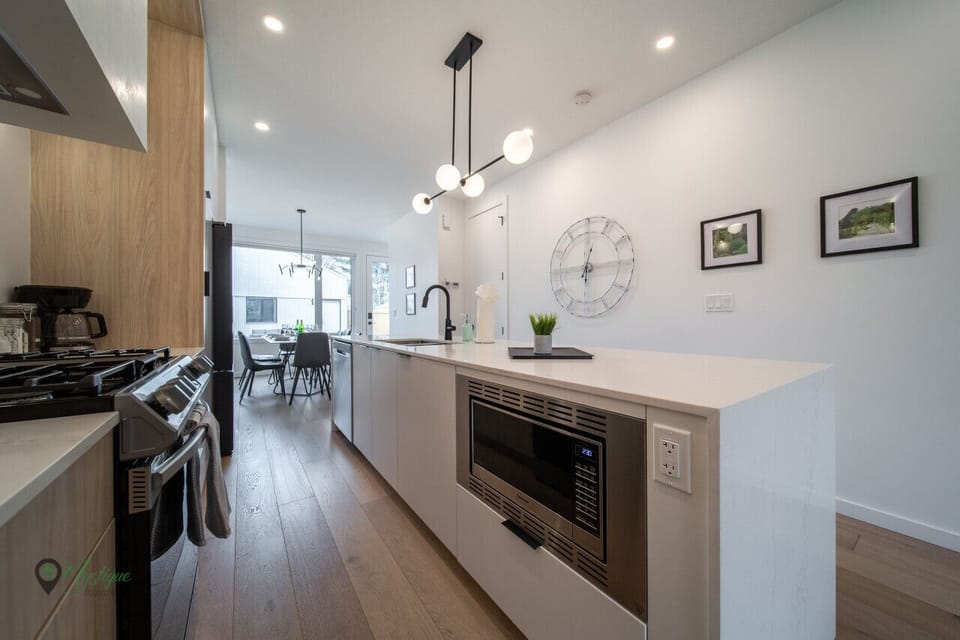 Microwave  and spacious kitchen cupboard storage