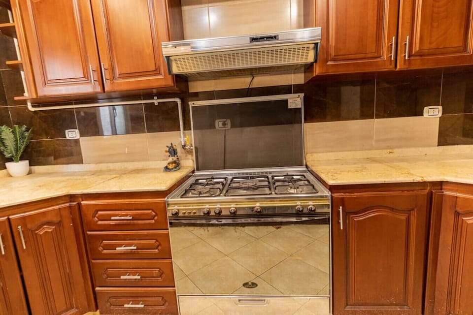 Whip up culinary delights in this modern kitchen, where every detail is designed for both style and functionality.