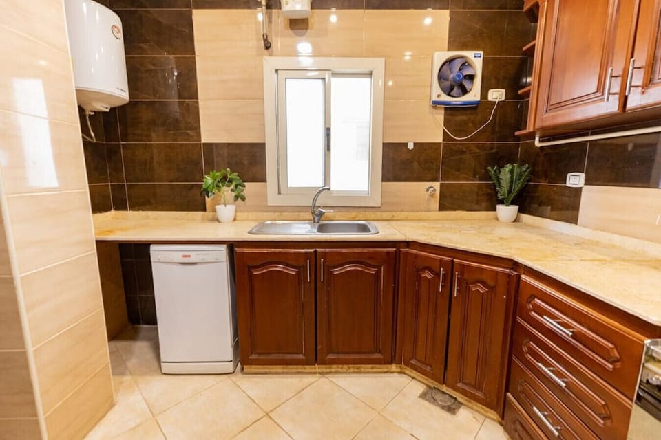 Whip up culinary delights in this modern kitchen, where every detail is designed for both style and functionality.
