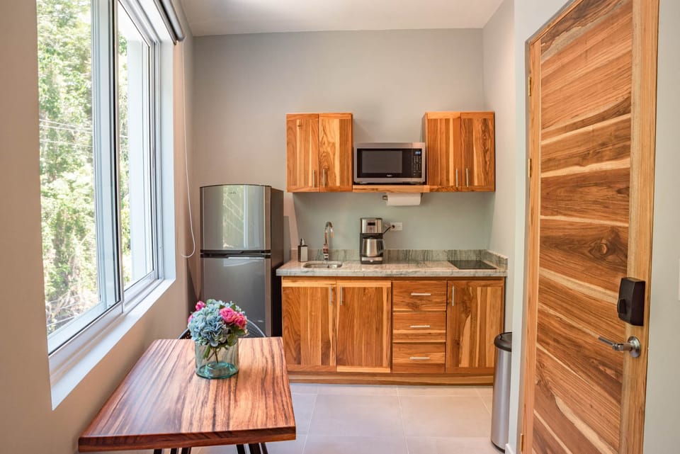 Kitchenette w refrigerator and 2 burner cook top stove