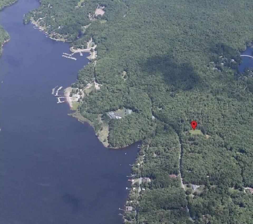 The house in relation to Swinging Bridge Lake