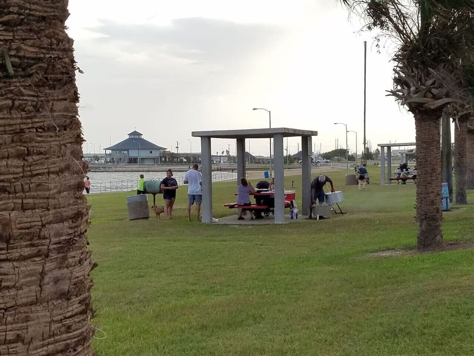 Plenty of Public Picnic tables with BBQ along the Palacios Seawall.
