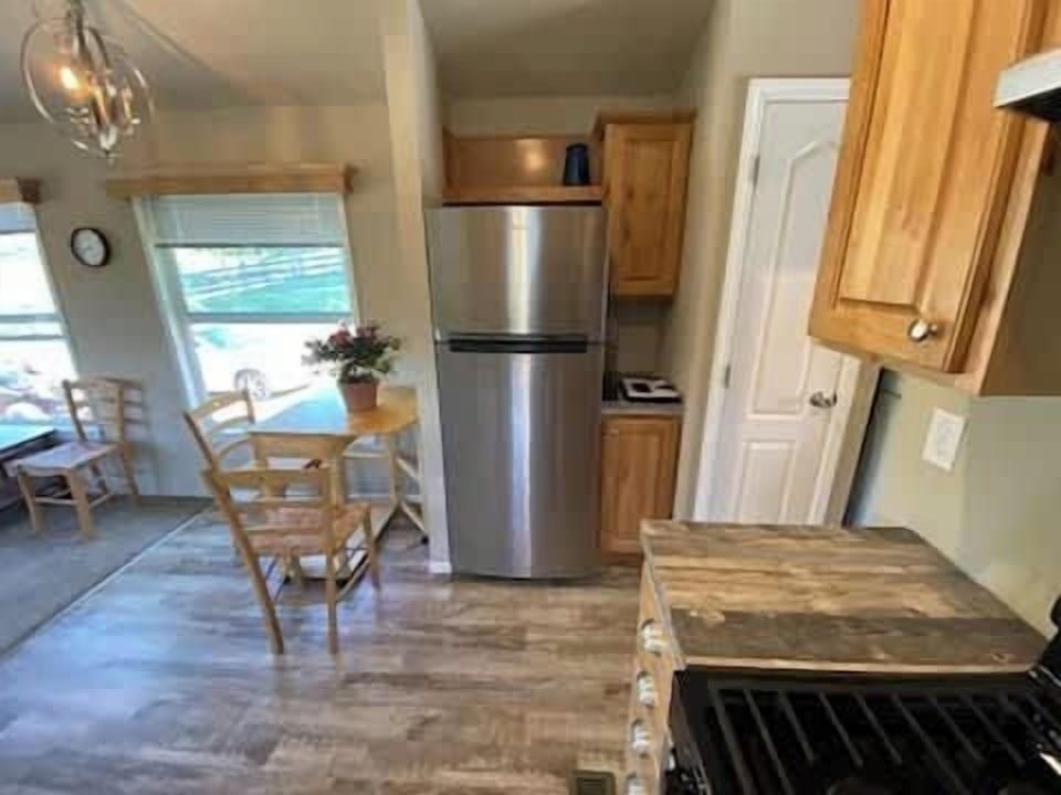 Kitchen and enough room at the dining table for 4 people.  