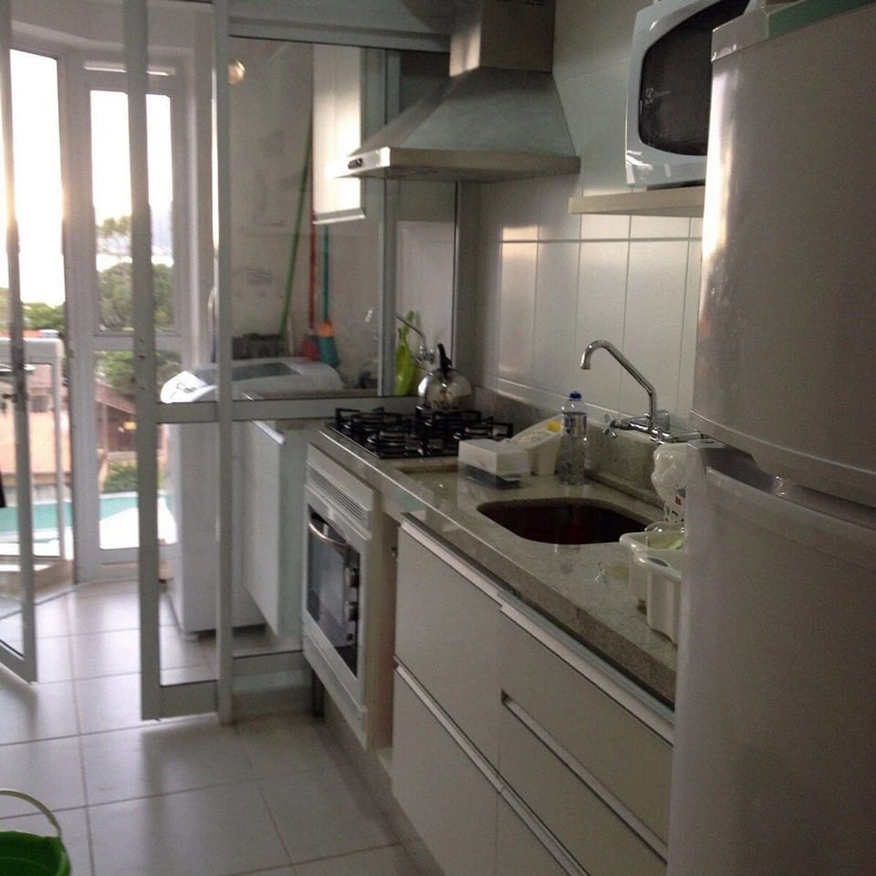 Premium Apartment, Pool Access, Sea View | Private kitchen | Cookware/dishes/utensils, dining tables