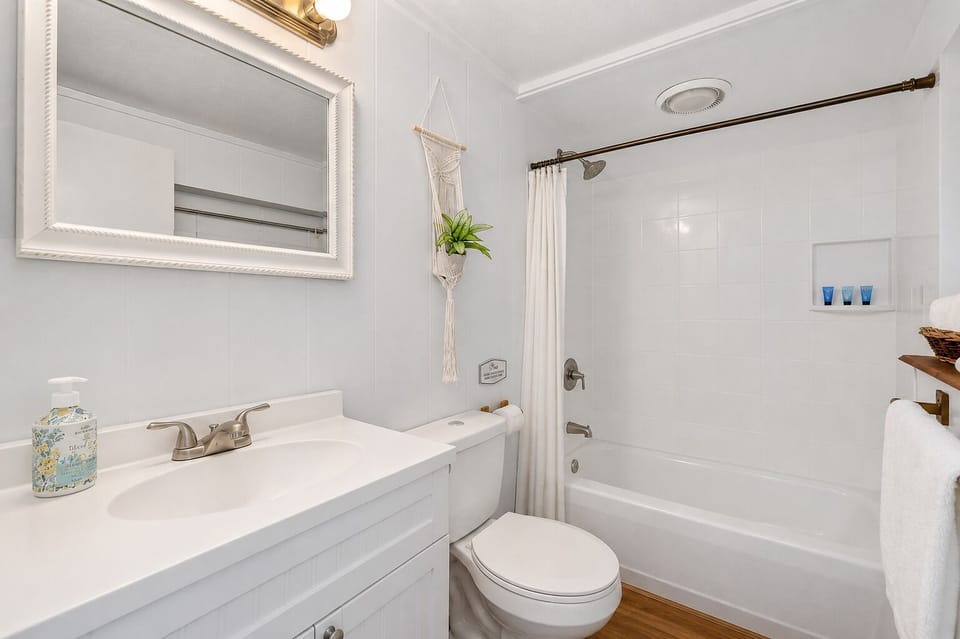 Bathroom with a shower-tub combo and a single vanity

