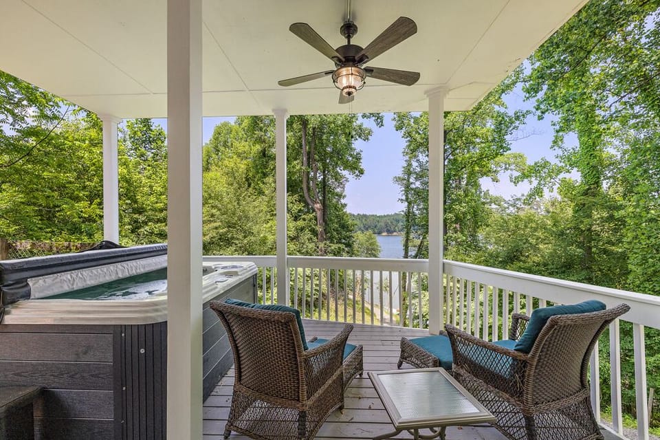 Hot Tub and Seating on the Covered Deck with a Lake View