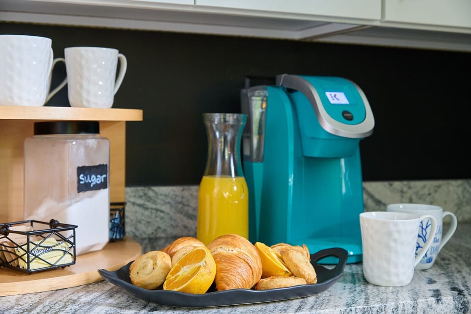 Coffee service includes Keurig, coffeemaker, kcups, creamers, and sugars