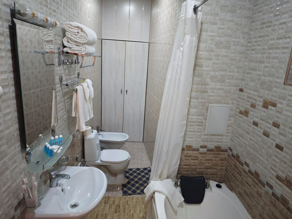 Family Double or Twin Room, 2 Double Beds | Bathroom | Shower, hair dryer, bathrobes, slippers