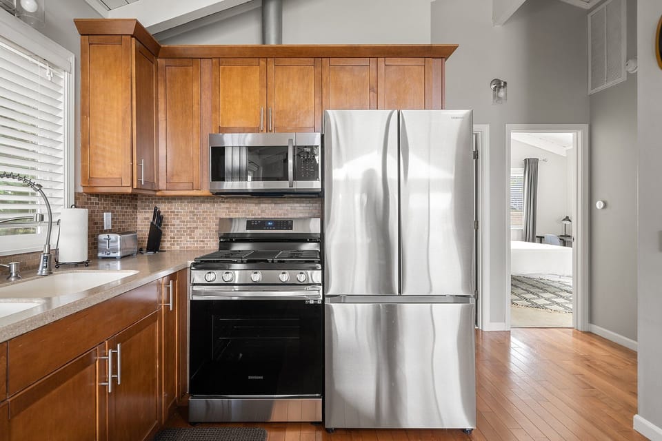 The kitchen is equipped for everyday cooking, with a full range of appliances and the tools needed to prepare meals.
