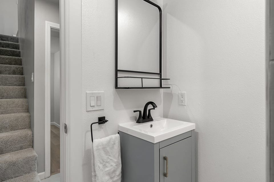 The home's second bathroom provides another convenient space for guests to freshen up during their stay.