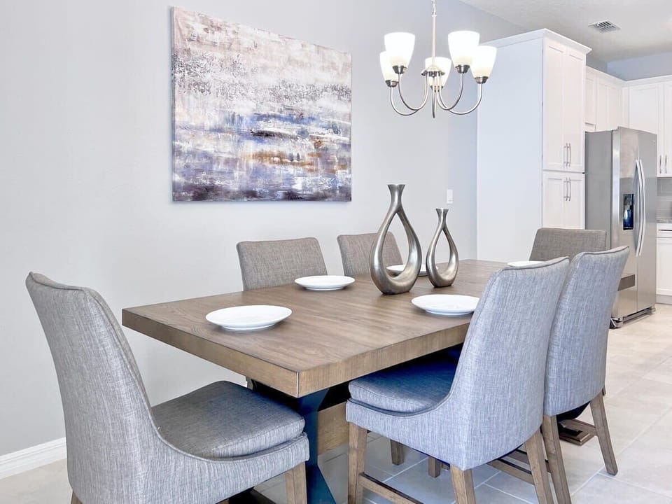 Enjoy memorable family meals around the dining table, where the open-concept layout keeps everyone connected to the kitchen and living room.