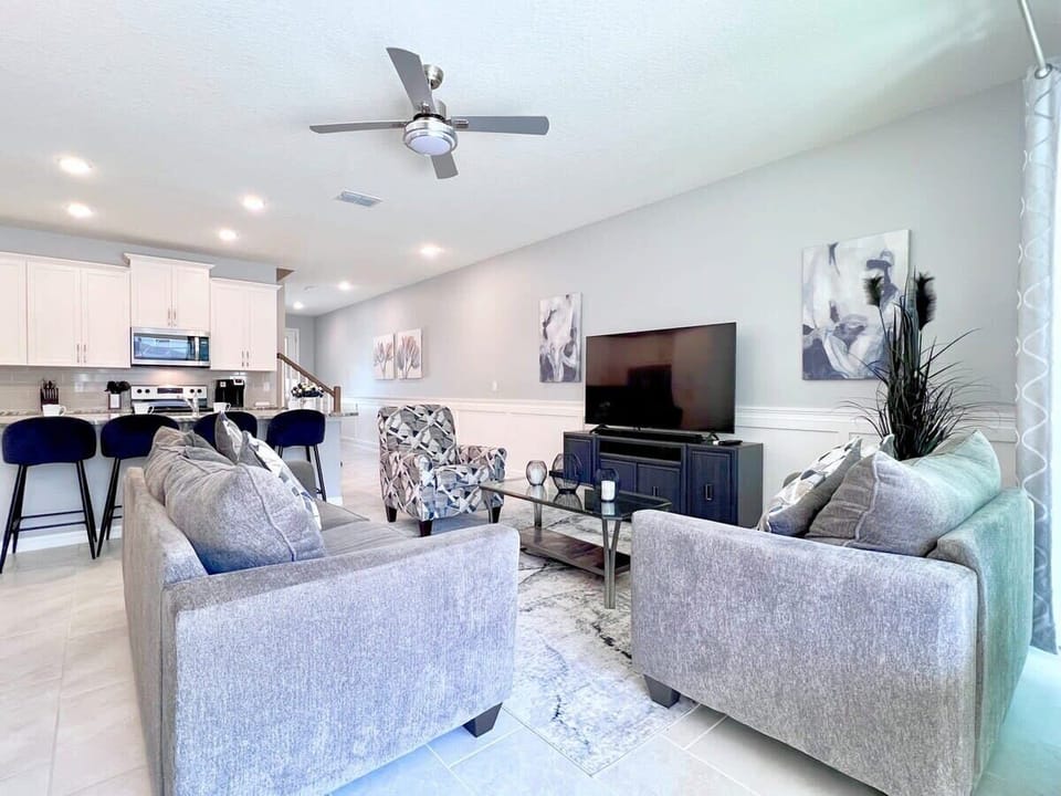 Kick back in the spacious living room with comfortable furniture, a large flat-screen TV, and complimentary high-speed Wi-Fi for the ultimate vacation experience.