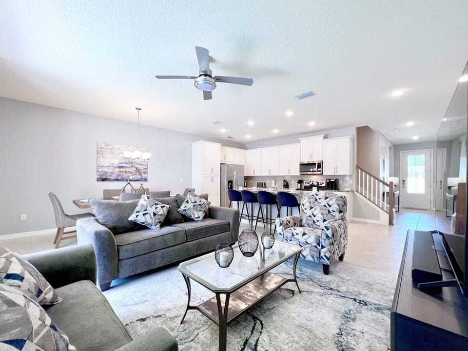 Kick back in the spacious living room with comfortable furniture, a large flat-screen TV, and complimentary high-speed Wi-Fi for the ultimate vacation experience.