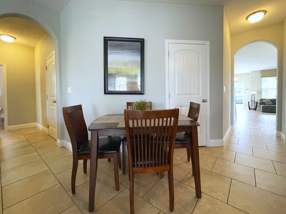 Enjoy memorable family meals around the dining table, where the open-concept layout keeps everyone connected to the kitchen and living room.